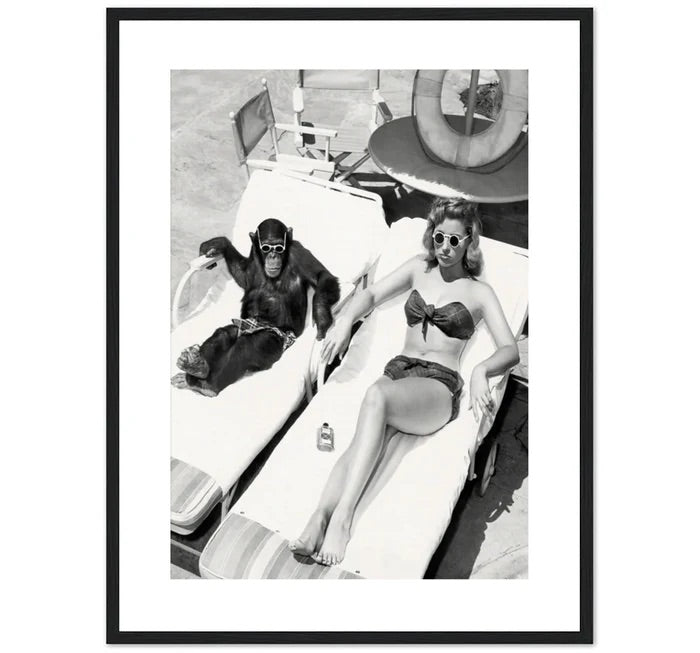 WOMEN SUNBATHING WITH CHIMPANZEE