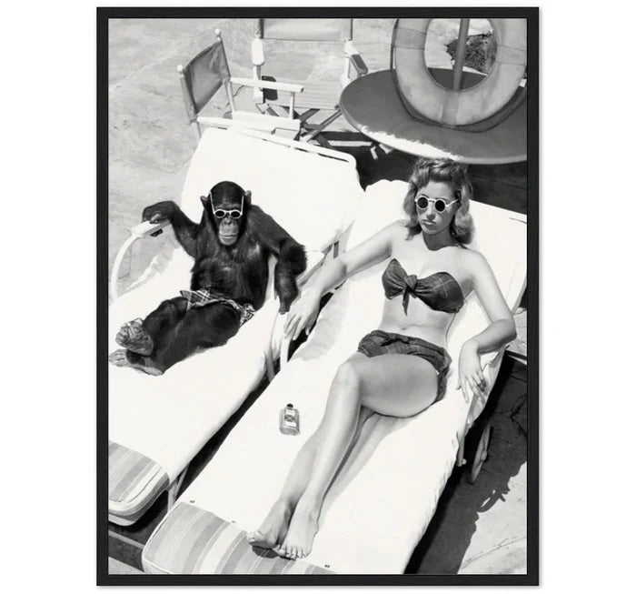 WOMEN SUNBATHING WITH CHIMPANZEE